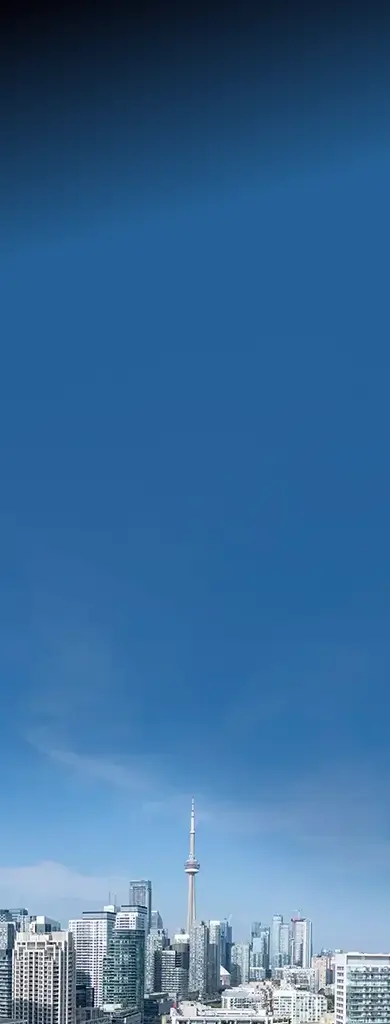 The Toronto skyline and the CN Tower under a clear blue sky