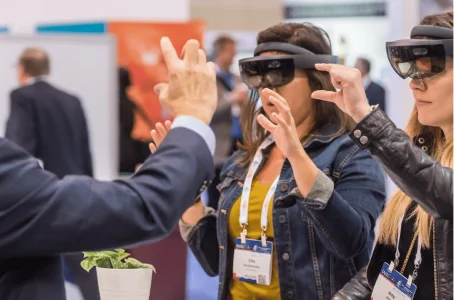 Attendees trying mixed-reality headsets at a technology conference