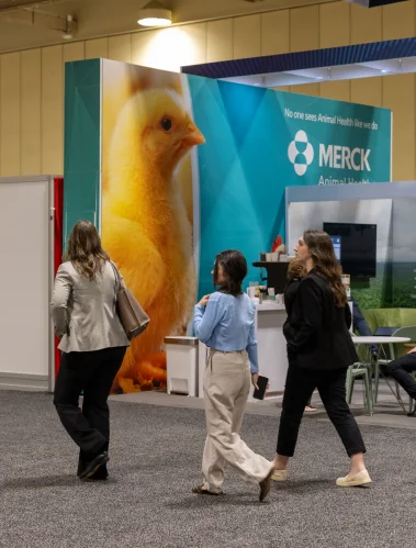 Visitors walking past a large bird sculpture at a science exhibition