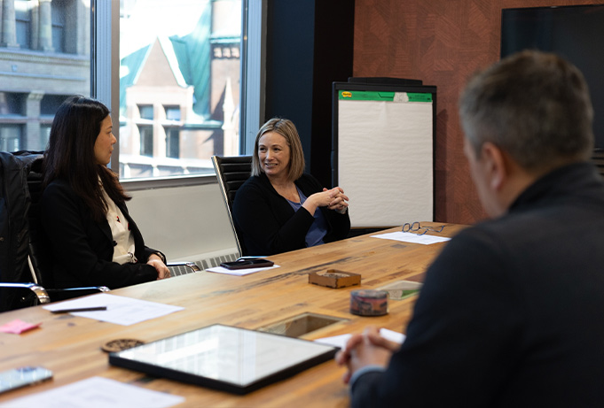 A small team meeting around a table in an office