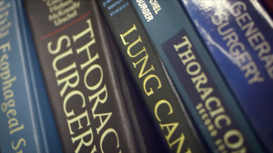 Medical books on thoracic surgery on a shelf