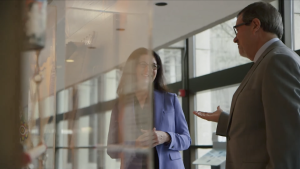 Dr. Maurice Bitran and Catherine Paisley talking in a hallway