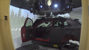 A car inside a driving simulator in a research lab