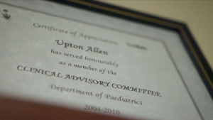 A framed certificate of appreciation for Dr. Upton Allen