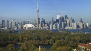 Toronto skyline with the CN Tower, seen above the trees