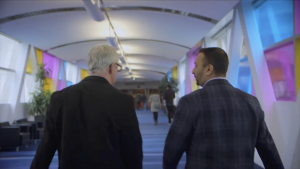 Robert Haller walking with a colleague through the Metro Toronto Convention Centre