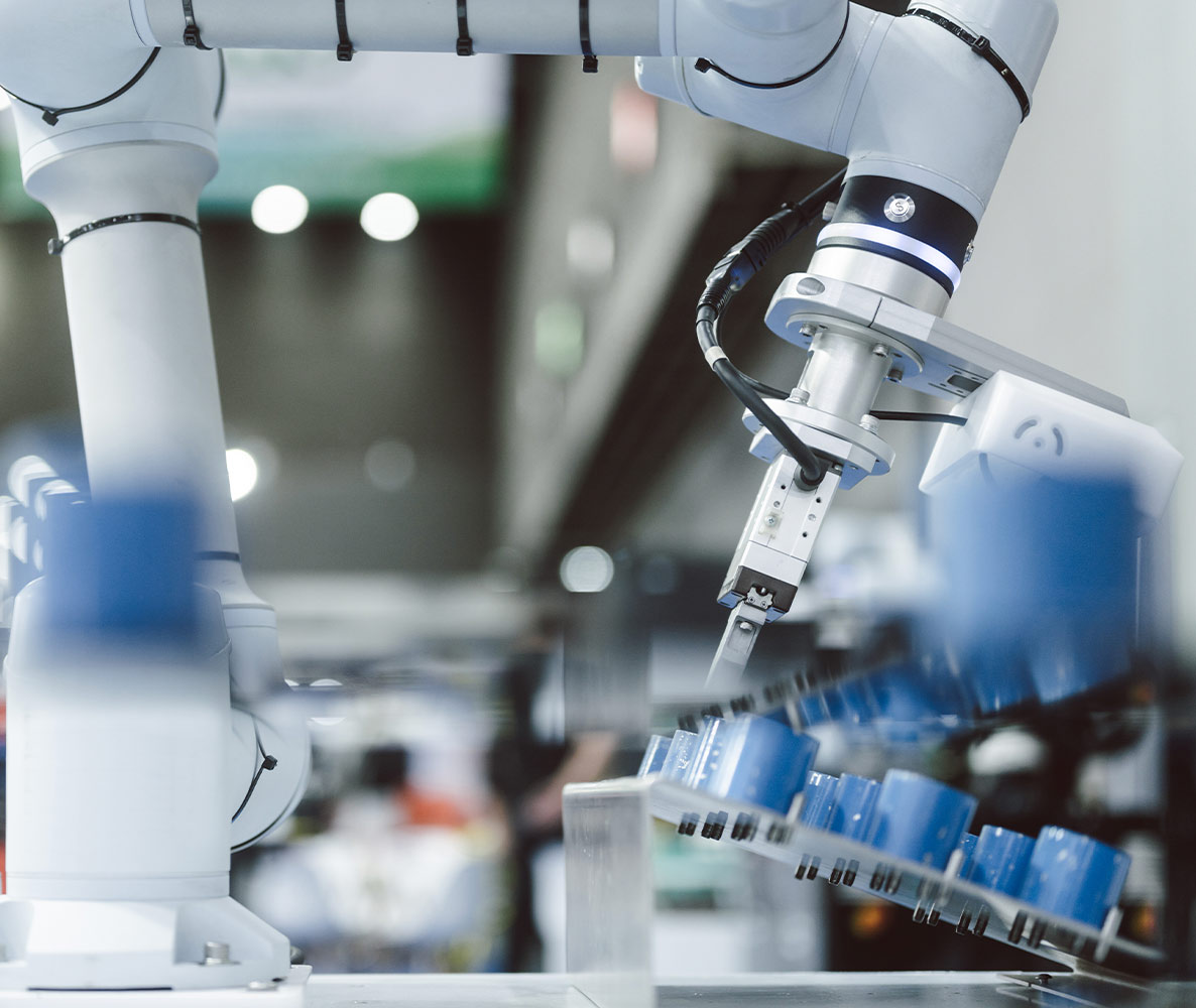 Robotic arms working on an automated production line